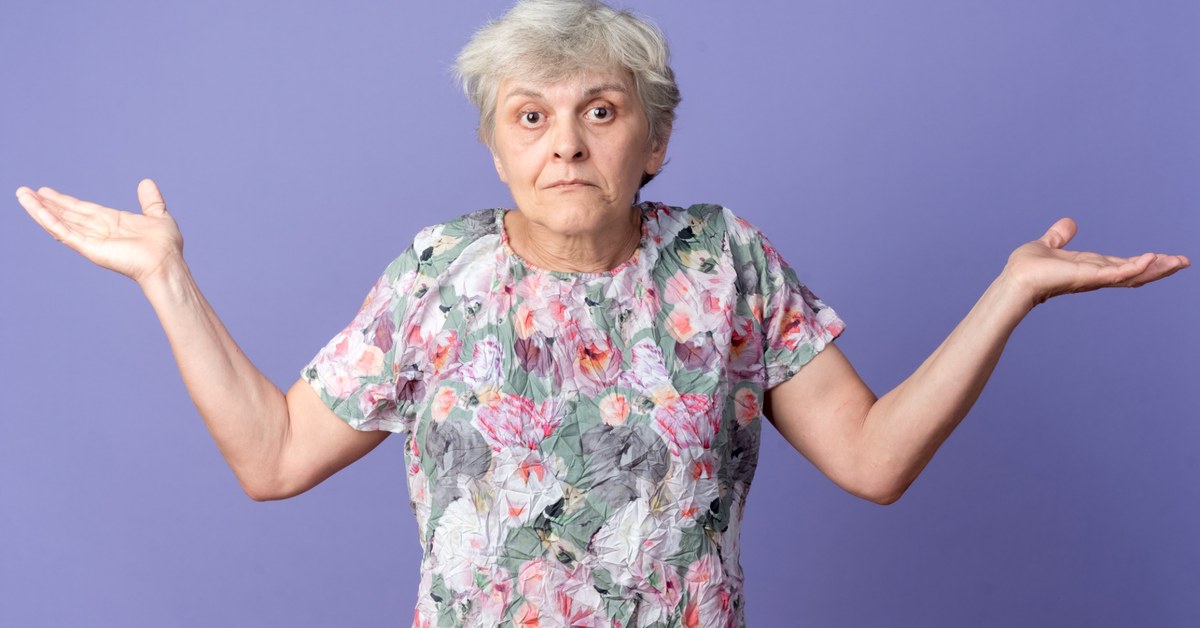 Elderly woman shrugging.